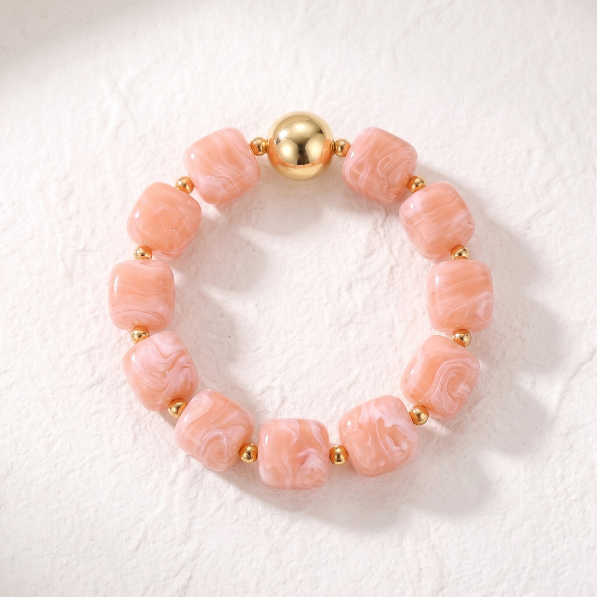 Koraalkleurige chunky armband