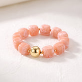 Koraalkleurige chunky armband